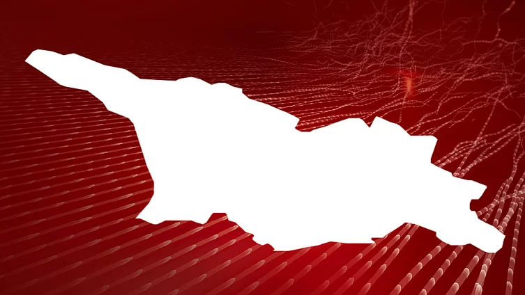 An image shows the outline of the map of Georgia in front of abstract red background