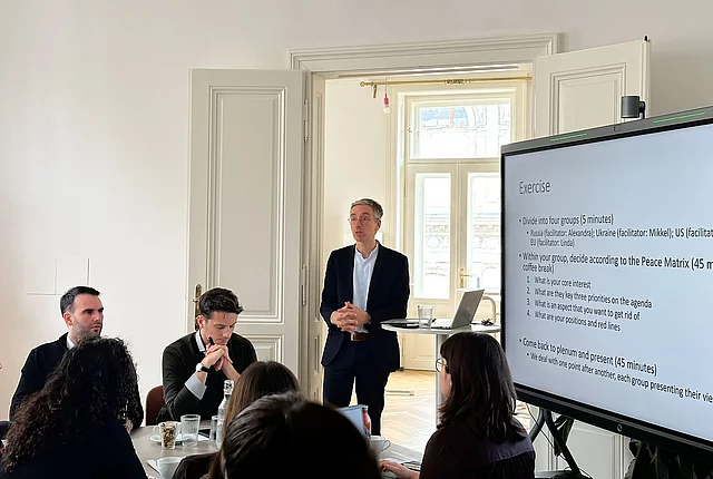 A photo shows Christos Katsioulis from Friedrich-Ebert-Stiftung at the event for OSCE young experts.