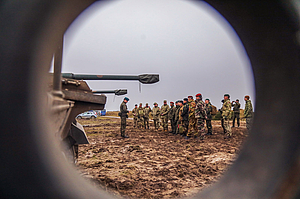Leaders from multiple nations receive a brief about the Polish AHS Krab, a self-propelled tracked gun-howitzer during Dynamic Front 23 live fire demonstrations at Oksbol, Denmark