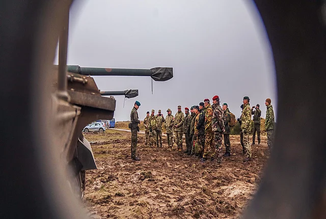 Leaders from multiple nations receive a brief about the Polish AHS Krab, a self-propelled tracked gun-howitzer during Dynamic Front 23 live fire demonstrations at Oksbol, Denmark