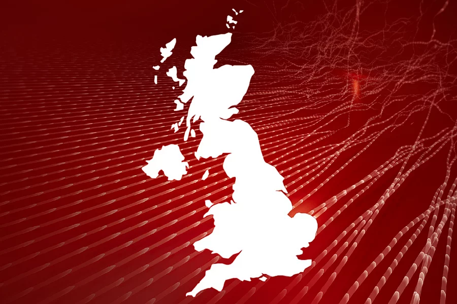An image shows the outline of the map of the United Kingdom in front of abstract red background