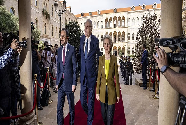 Lebanese caretaker Prime Minister Najib Mikati, center, welcomes Cyprus' President Nikos Christodoulides, left, and President of the European Commission Ursula von der Leyen at the government palace in Beirut, Lebanon, Thursday, May 2, 2024.