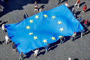People holding the EU flag