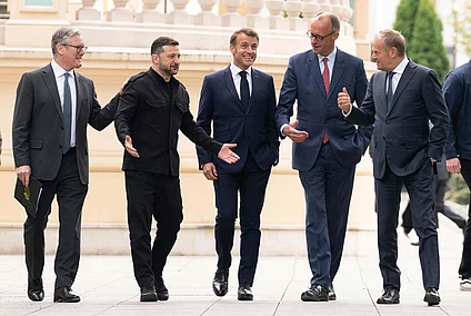 From left, British Prime Minister Keir Starmer, Ukrainian President Volodymyr Zelenskyy, French President Emmanuel Macron, German Chancellor Friedrich Merz and Poland's Prime Minister Donald Tusk walk at the Presidential Palace in Kyiv, Ukraine, Saturday May 10, 2025.