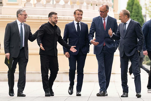 From left, British Prime Minister Keir Starmer, Ukrainian President Volodymyr Zelenskyy, French President Emmanuel Macron, German Chancellor Friedrich Merz and Poland's Prime Minister Donald Tusk walk at the Presidential Palace in Kyiv, Ukraine, Saturday May 10, 2025.